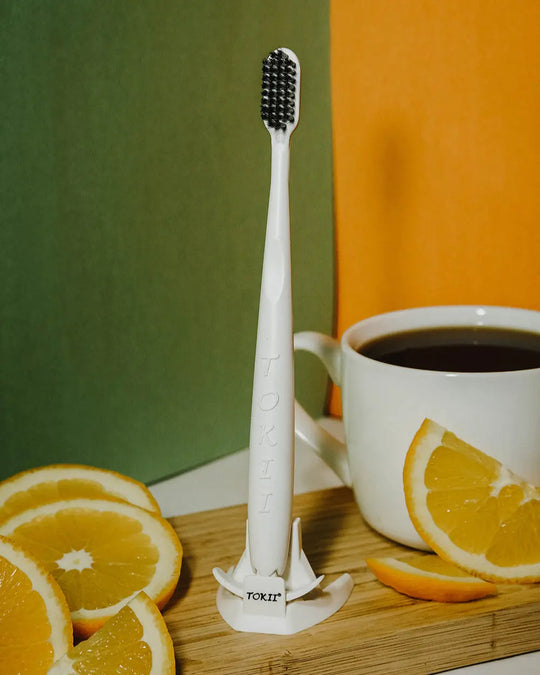 Eco-friendly Tokii white toothbrush for sustainable oral care