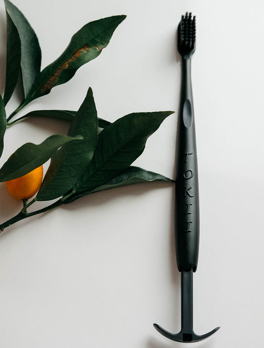 Tokii –  Toothbrush with attached Sliding Tongue Scraper