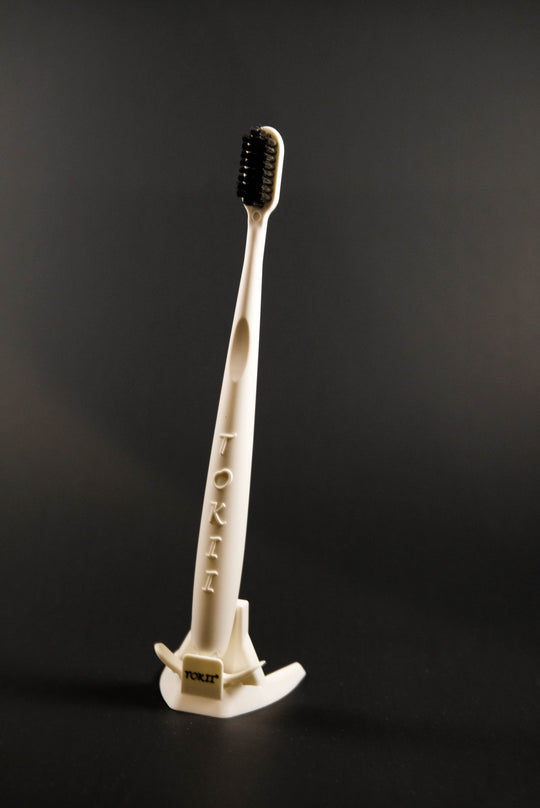 Tokii –  Toothbrush with attached Sliding Tongue Scraper