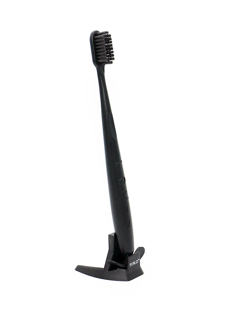 Tokii –  Toothbrush with attached Sliding Tongue Scraper